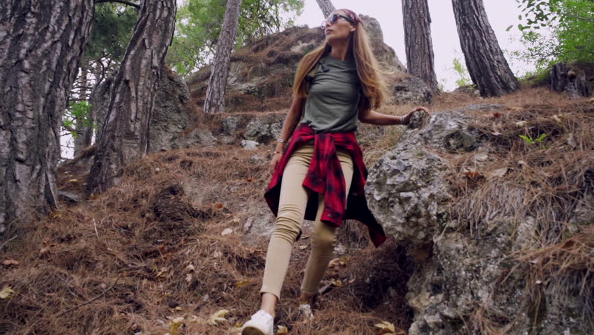 Trekking with backpack in the forest