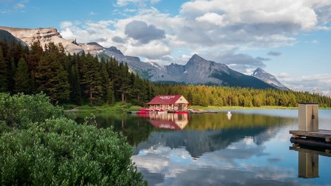 Time lapse view of Maligne Lake boat house at sunset in Jasper National Park, Alberta, Canada. Zoom in.