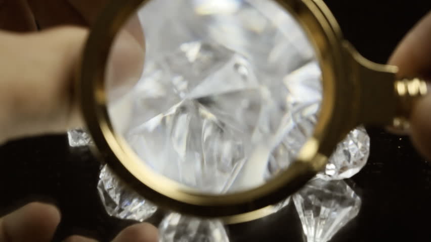 magnifying glass to look at diamonds