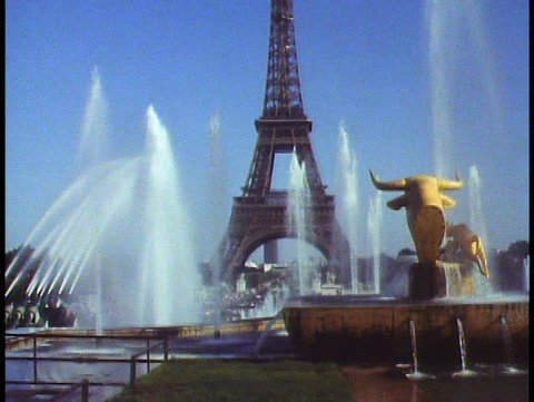 PARIS, FRANCE, 1988, The Eiffel Tower, fountain and golden bull, tilt up