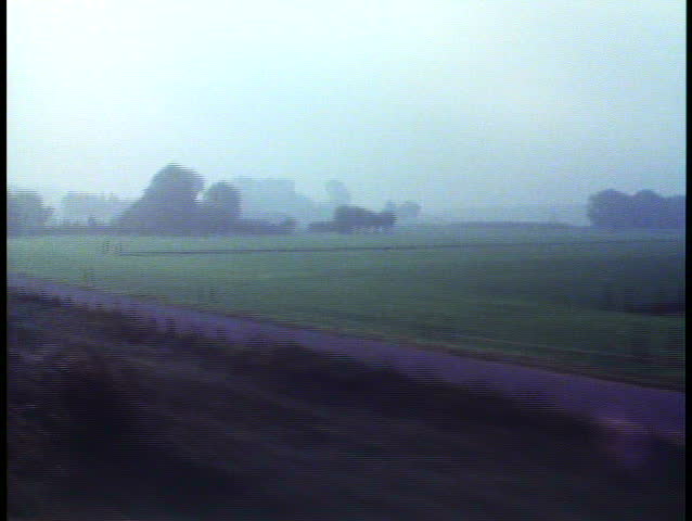 AMSTERDAM, THE NETHERLANDS, 1988, Holland, POV from train, passing countryside