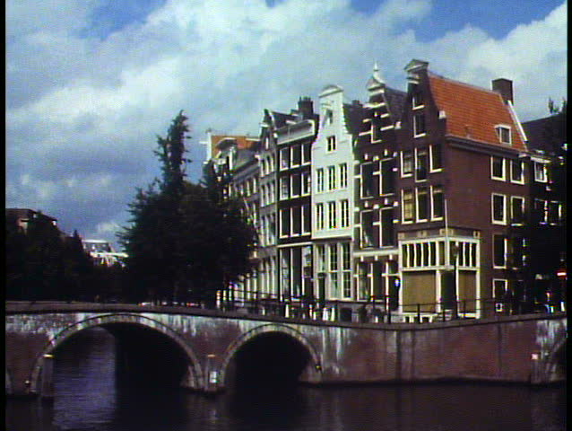 AMSTERDAM, THE NETHERLANDS, 1988, Holland, wide shot of canals, houses, bridge