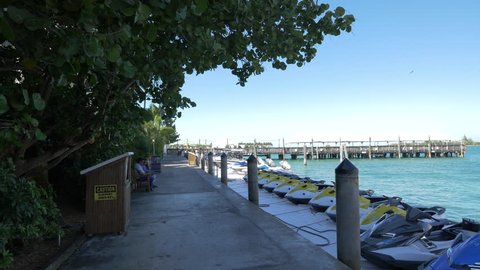 Miami, United States - July, 2016: Jet skis moored on the waterfront