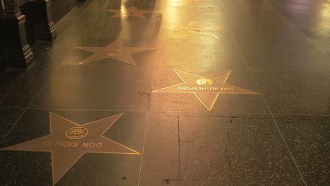 Los Angeles, United States - August, 2016: Winnie the Pooh, Tinker Bell stars and others on the Hollywood Walk of Fame