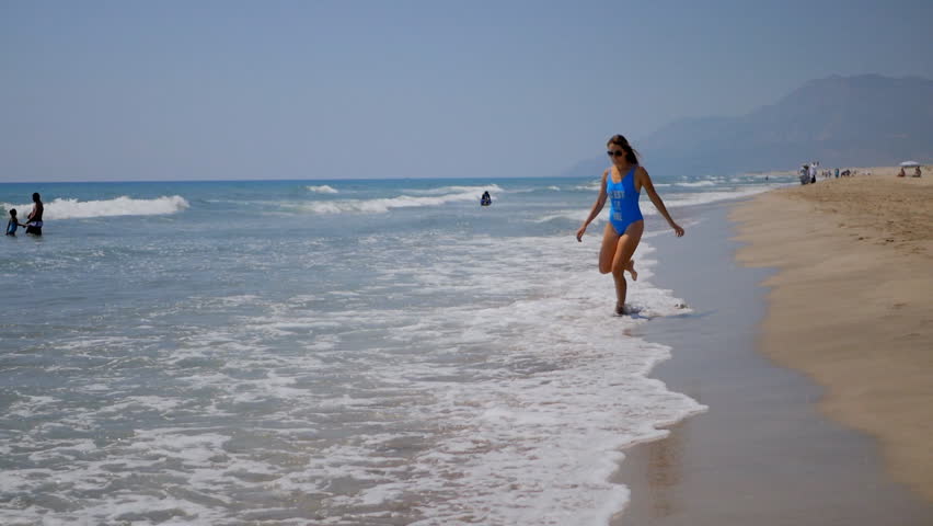 Young woman having fun sandy beach.