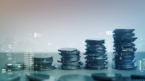 Double exposure of city view, rows of coins for finance and business concept