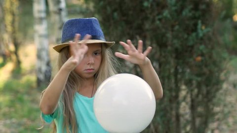 Girl is a witch. Bad trick with a white ball. 