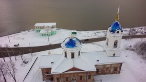 Aerial view of Church in Russia. Clip. Small town Church during snowy winter in a small town
