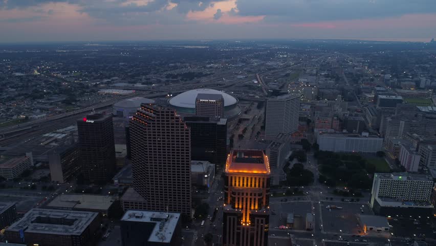 NEW ORLEANS, LOUISIANA, USA - AUGUST 1, 2018: Aerial night footage of New Orleans Louisiana towers downtown