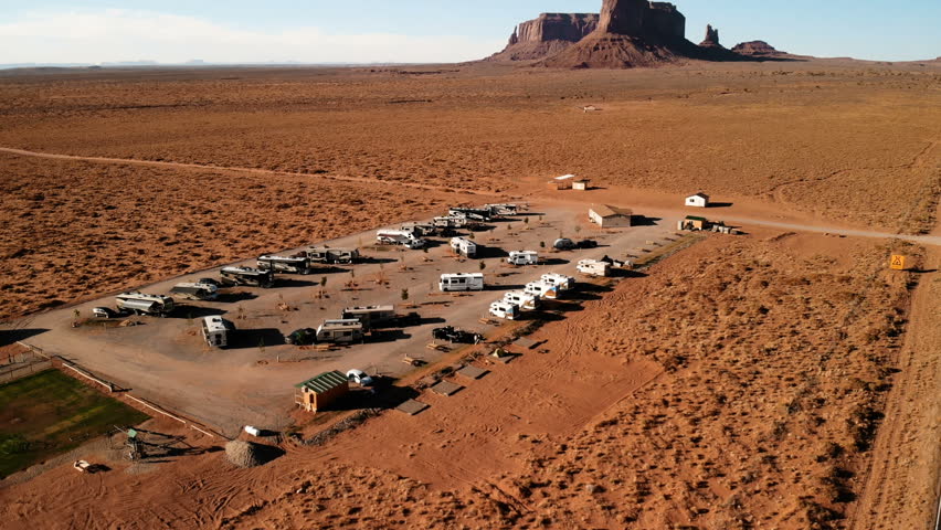 RV park (campground) near the Oljato–Monument Valley, Utah. Aerial view of parking, from above, drone shooting. Arizona - Utah border