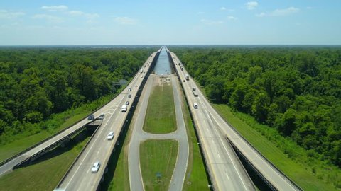 Aerial drone video of I10 over the Atchafalaya River and nature preserve Louisiana USA 4k
