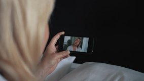 Women chat on video chat on a smartphoneWomen chat on video chat on a smartphone