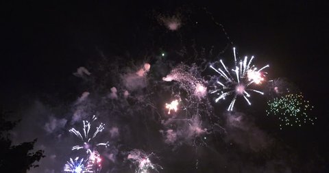 4K high quality video footage of beautiful night sky fireworks explosions night summer show on annual pyrotechnical international festival in celebrations near Moscow River in Moscow, Russia