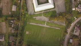 Video aerosooting of football at the stadium in the village. Rural football.