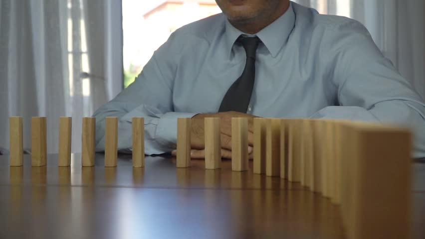 Wooden blocks falling in line business concept Royalty-Free Stock Footage #1015289263