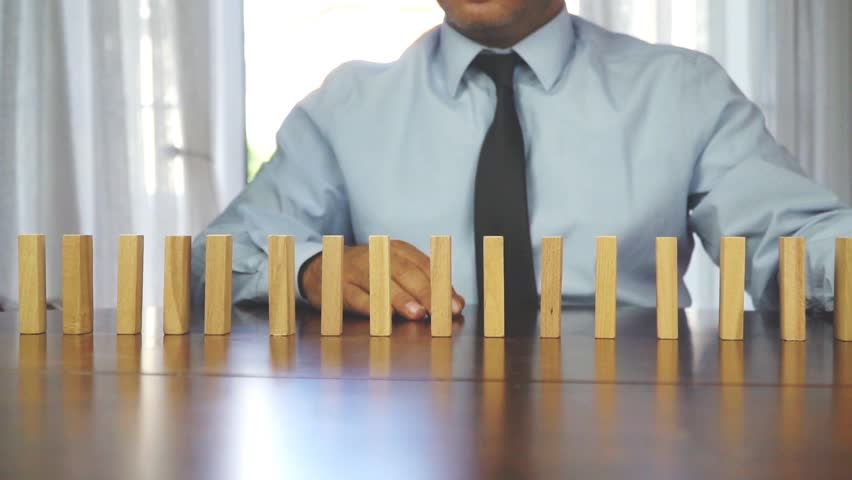Wooden blocks falling in line business concept Royalty-Free Stock Footage #1015289272