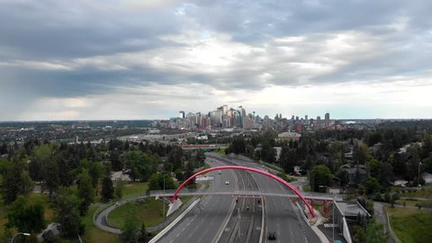 Calgary, Alberta, Canada, aerial view of traffic on highway with Downtown buildings in the background during daytime. 