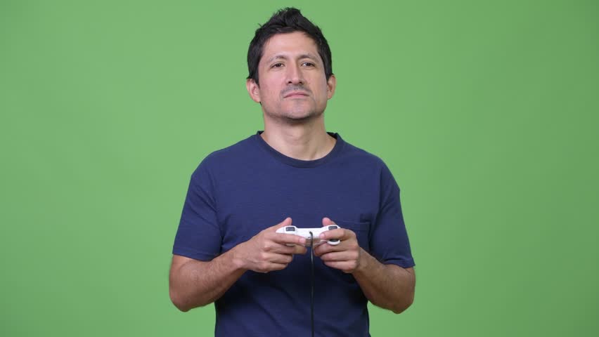 Hispanic man playing games and falling asleep