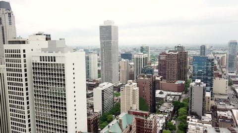 Aerial video of Chicago Illinois between buildings