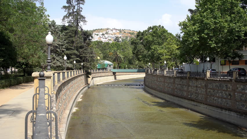 View of the rio Genil river in summer, center Granada, spain