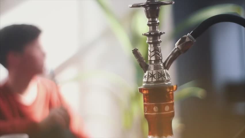 young man smoking hookah