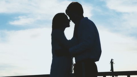 Young couple in love - silhouette. Love and relationships 