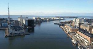 4K high quality summer morning aerial video of Helsinki Baltic Sea Finnish Bay lagoon, Hietalahti shipyard area, boats and calm water surface in the capital of Finland Suomi, northern Europe