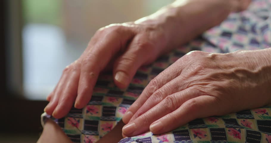 young person helps her grandmother to get up taking her hands. concept of elderly support and retirement help. help to people in need Royalty-Free Stock Footage #1015331068