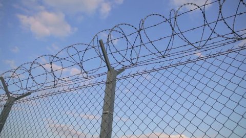 Barbed Wire On Net Fence Stock Footage Video 100 Royalty Free Shutterstock
