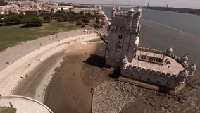 Beautiful scenic drone shot panning around the Belem Tower in Portugal.