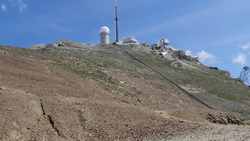 woman hiker on the trail of  Pic du Midi de Bigorre in the Pyrenees
