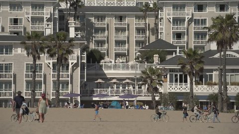 Santa Monica, United States - June, 2017: Tourists and hotel on the beach