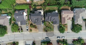  An aerial 4k 29.97fps footage of green grass, streets and houses