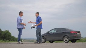 two men make deal. man handshake seller driver makes car the auto insurance slow motion video sale sells used cars. Buying rent a car . man car insurance sale of used cars concept. man test drive car
