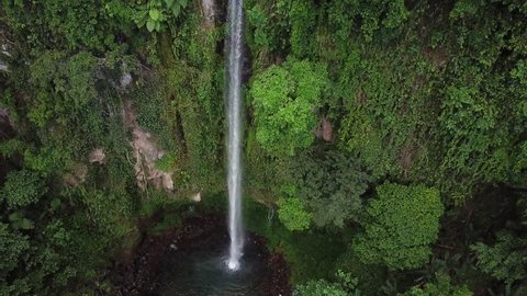 Aerial footage of the lush Katibawasan falls in Camiguin, Philippines