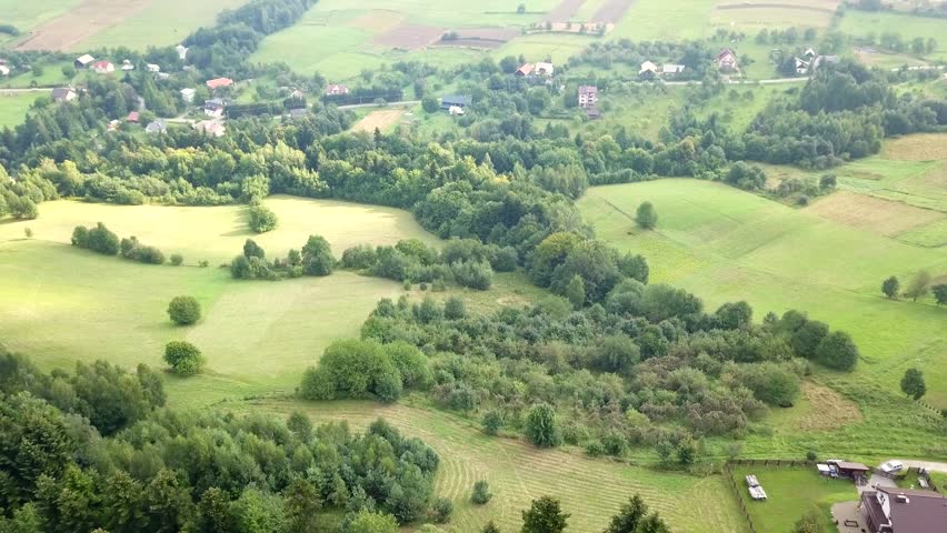 Beautiful aerial shot of green hills and valleys. Nature of Bieszczady Mountains seen from above.
