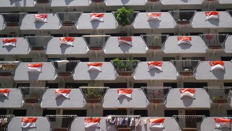 Selegie House/Singapore - 20th Aug 2018: Wide Shot Of The Facade Of A Public Housing Apartment In Singapore Decorated With Wind Blown Singapore Flags