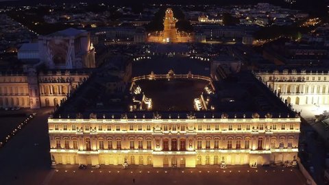 Palace of Versailles at night seen from the sky - Aerial Video