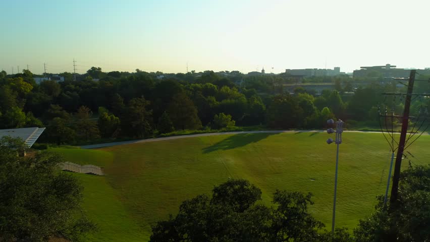 Aerial video of Houston Texas park landscape reveal downtown city