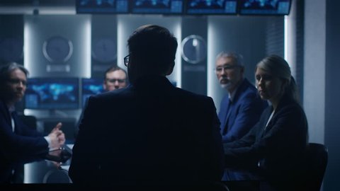 Chief Strategy Officer Making Report to a Board of Directors During Annual Financial Meeting in the conference Room. Shot on RED EPIC-W 8K Helium Cinema Camera.