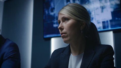 Portrait of the Strong Minded Female Government Agency Official Speaking on a Meeting. Serious Business People Negotiating. Shot on RED EPIC-W 8K Helium Cinema Camera.