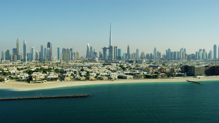 Aerial coastal shoreline beach view of and city skyscrapers United Arab Emirates Persian Gulf Middle East Dubai RED WEAPON | Shutterstock HD Video #1015398964