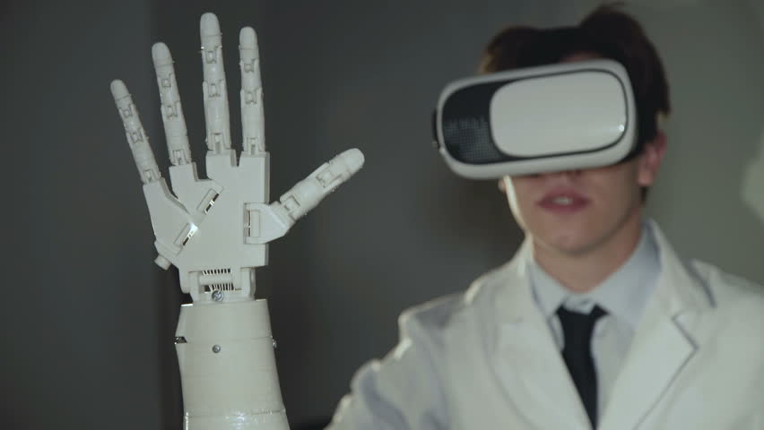 The scientist testing the robotic hand used vr glasses in the lab. 4K.