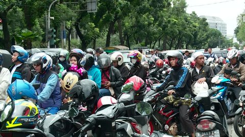 Jakarta, Indonesia - December 1, 2017: Congestion due to illegal motorcycle parking around Monas area, Jakarta, Indonesia.