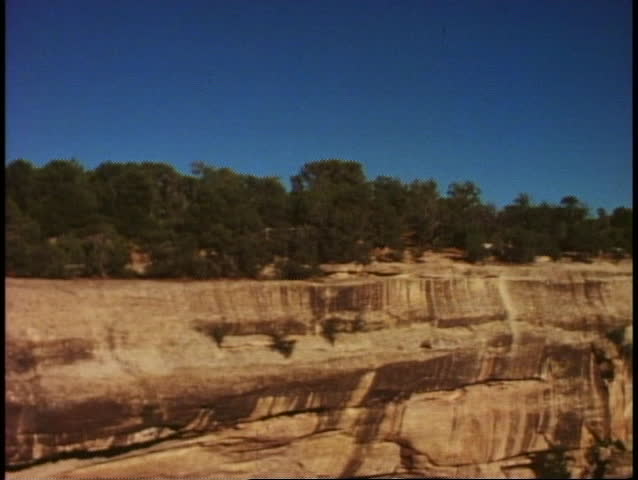 MESA VERDE NATIONAL PARK, COLORADO, 1978, wide shot, the cliff houses, tilt down