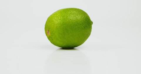 Fresh lime fruit isolated on whate background. Fresh lime fruit isolated on white background and moving round