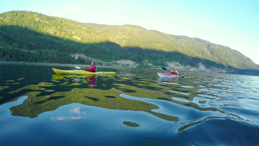 Tourist rowing a boat in the river on a sunny day 4k