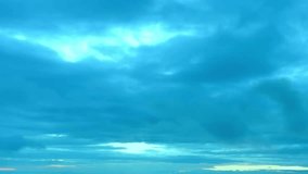 Fast motion clouds in evening time, rolling, formating, building cloudscape in very clear blue sky, soft after rain time. fantastic footage.