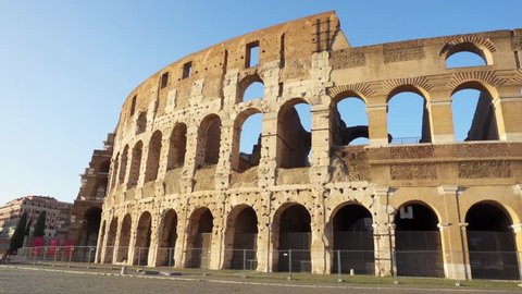 Famous Italian attraction Colosseum in Rome. Veiw on ancient Flavius amphitheater Coliseum in capital of Italy. Camera moving from left to right