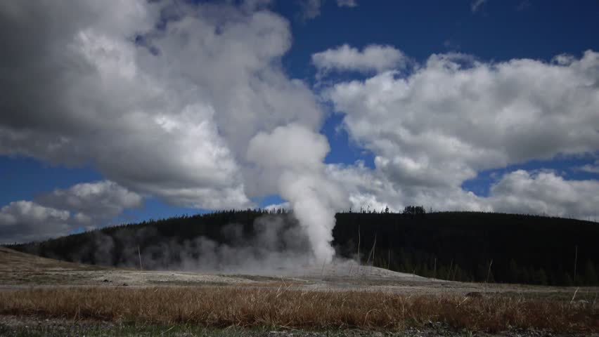 Geyser Old Faithful erupts in Yellowstone National Park in Wyoming, USA